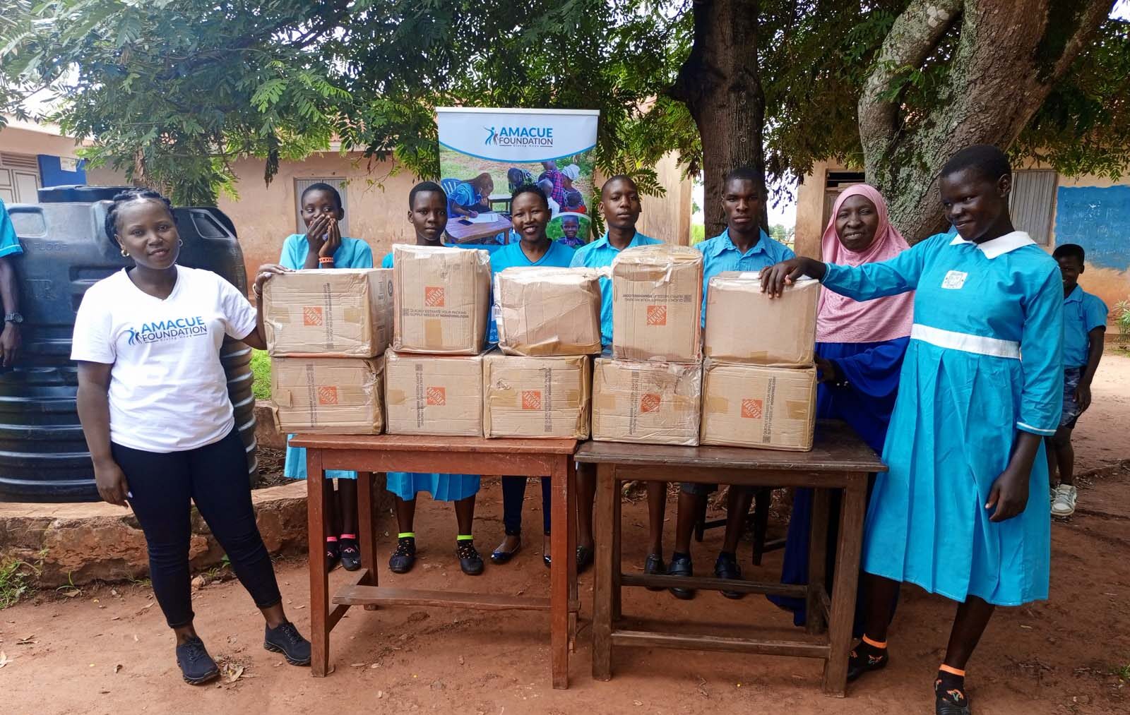 Amacue Foundation receives a donation of books on behalf of Bukakande Muslim Primary School